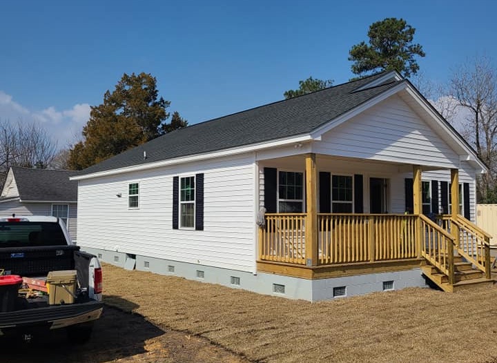 the team at Collins Roofing and Repair installing a new roof at a client in florence county